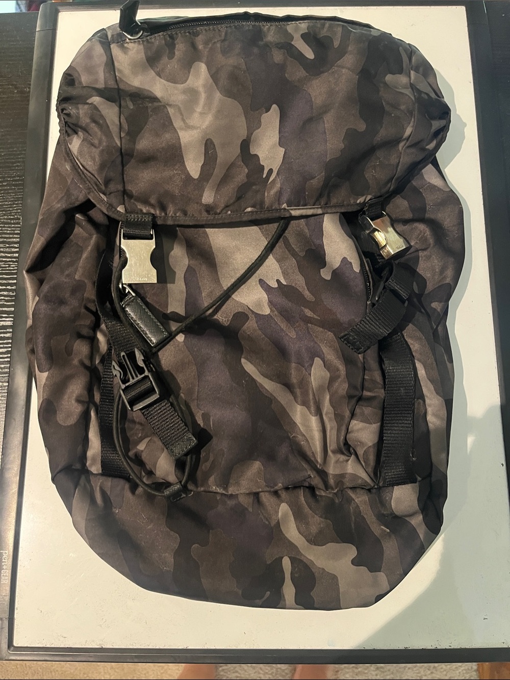 Women’s Prada Drawstring Backpack with interior and exterior pockets